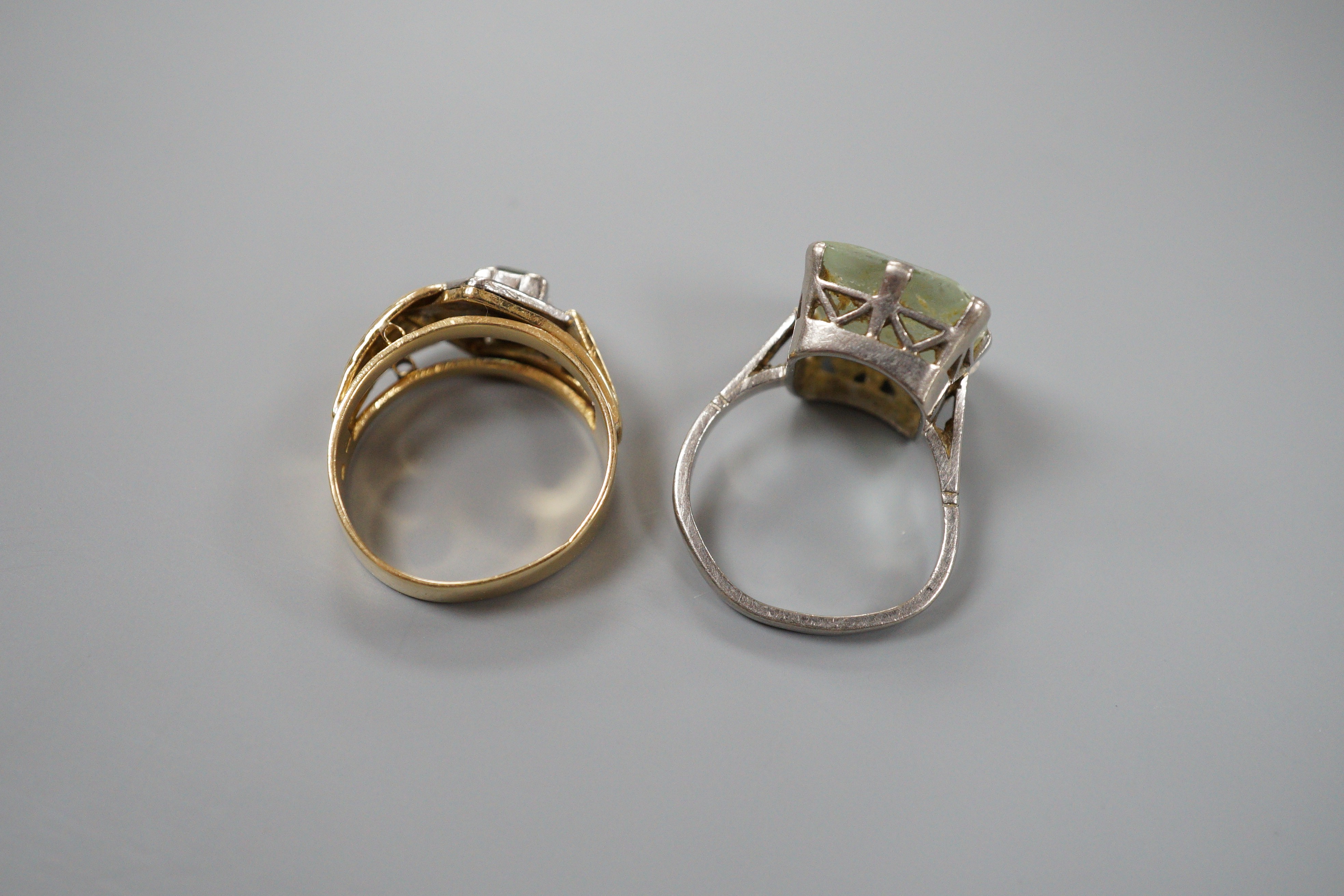 An 18ct white metal and paste set ring, gross 6.1 grams, and one other continental diamond and tourmaline? set cluster ring, stamped 8ct, gross 5.9 grams.